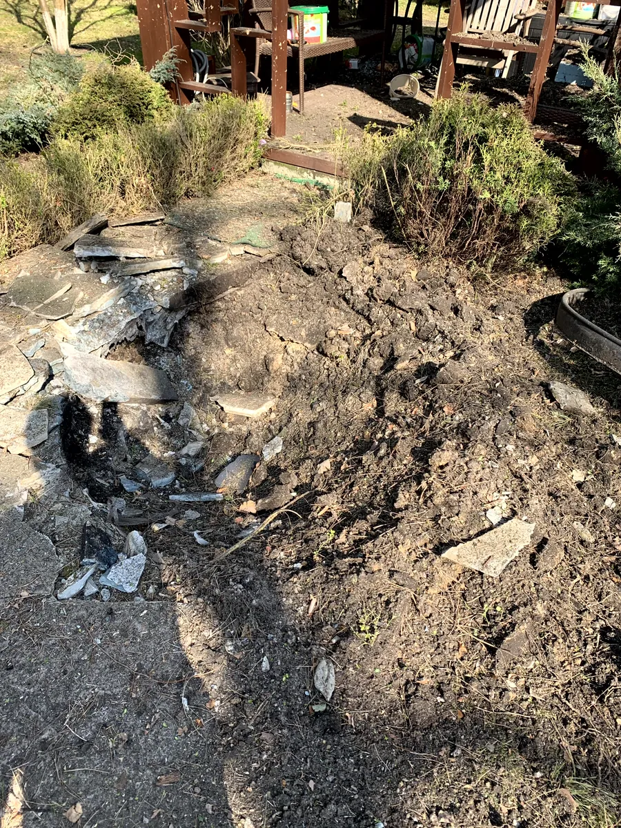 Torn-up ground and debris in the garden
